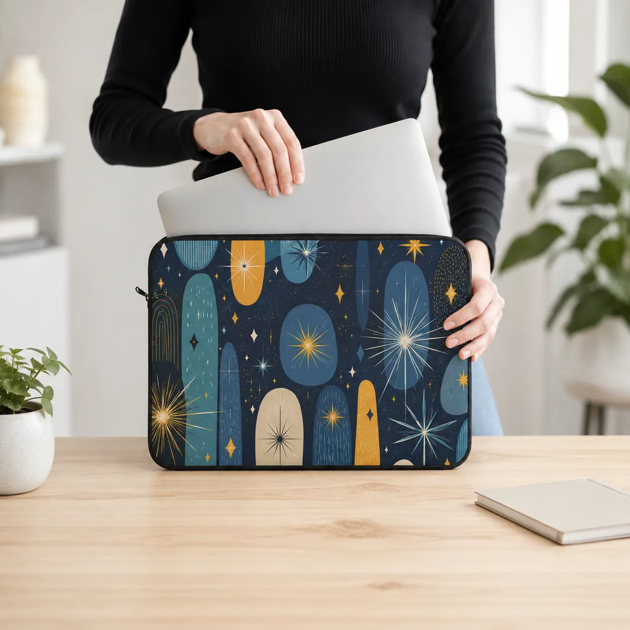 Navy celestial laptop sleeve shown in use with a laptop